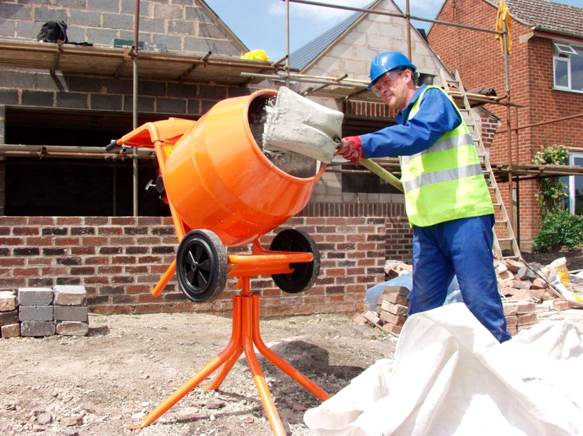 A concrete mixer is a device for mixing concrete and other solutions
