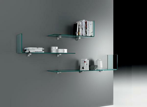 Shelves of polished glass with laconic chrome elements perfectly fit into the interior of the living room, made in the style of high-tech