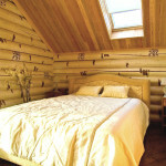 Diseño del dormitorio en una casa de madera