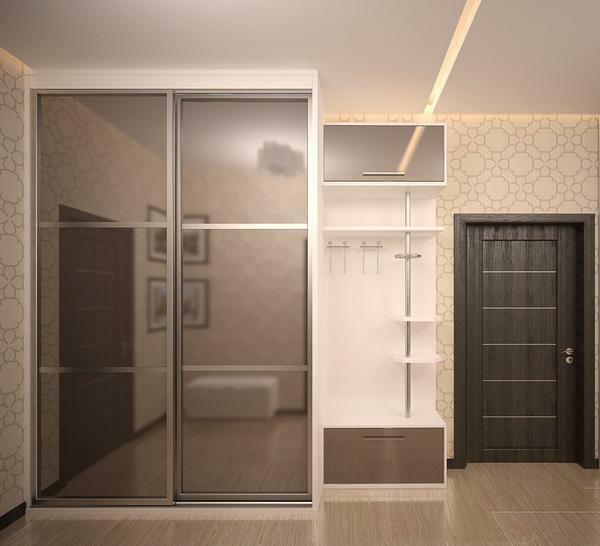 A large beautiful wardrobe with mirrored doors will perfectly cope with the task of visual expansion of space in a small hallway
