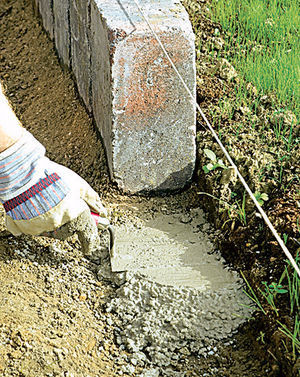 Installation curb stone in the country