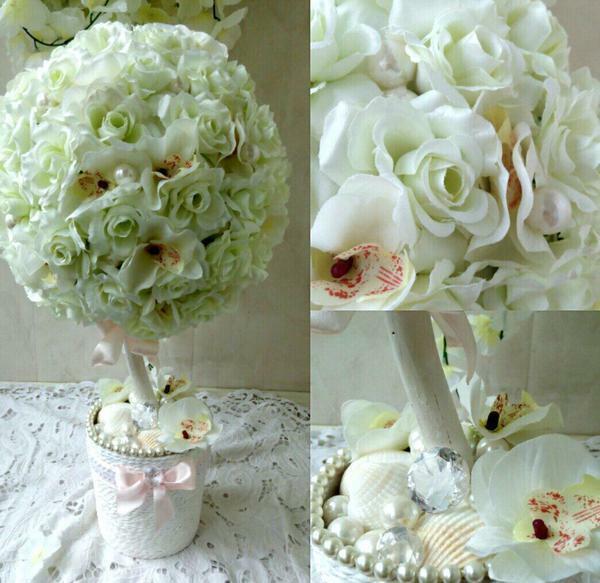 Kies een ontwerp voor bruiloft topiary makkelijk, maar je moet wel rekening houden met de voorkeuren van de jonggehuwden en hun leeftijd
