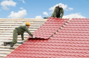 Repair of the roof of a private house: repairing the roof of metal and slate cottage