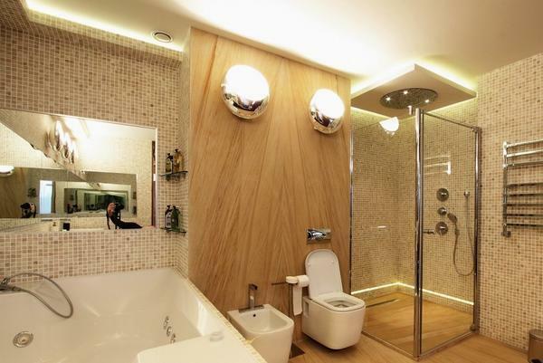 Banyoda ise - oda bir arka ışık kullanmak en iyisidir, oldukça büyük olduğunu ve uzmanların yardımı olmadan ekleyebilirsiniz