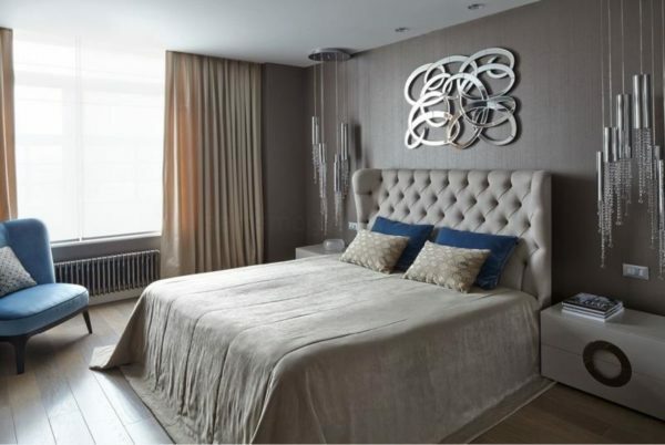 Above the headboard, you can hang a mirror panels for the effective design bedroom