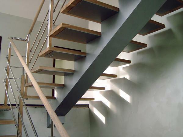 Finishing of the staircase with wood: facing of the metal frame, wooden covering of the metal frame, steps
