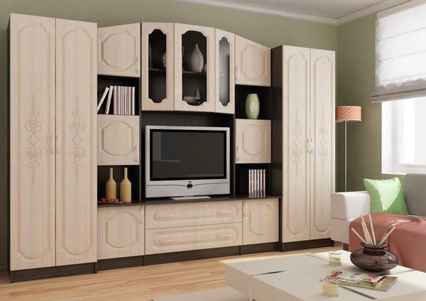 An excellent solution for a small living room will be a multifunctional and roomy furniture wall