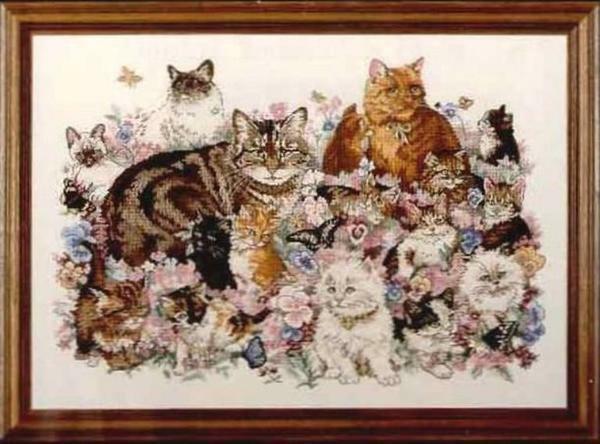 Cross-stitch embroidery of a cat scheme: seals for free, black and white and red on the roof, download sets, British