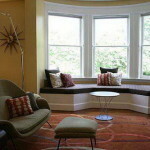 The design of a living room with a bay window