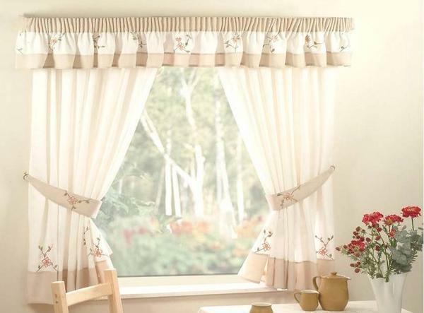 Many prefer to decorate the windows in the kitchen with curtains, as it is practical and convenient