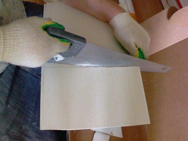 Cutting the plastic panel hacksaw