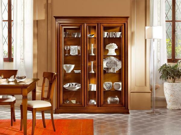 In the living room, executed in classical style, a wooden buffet of oak or walnut will fit in well