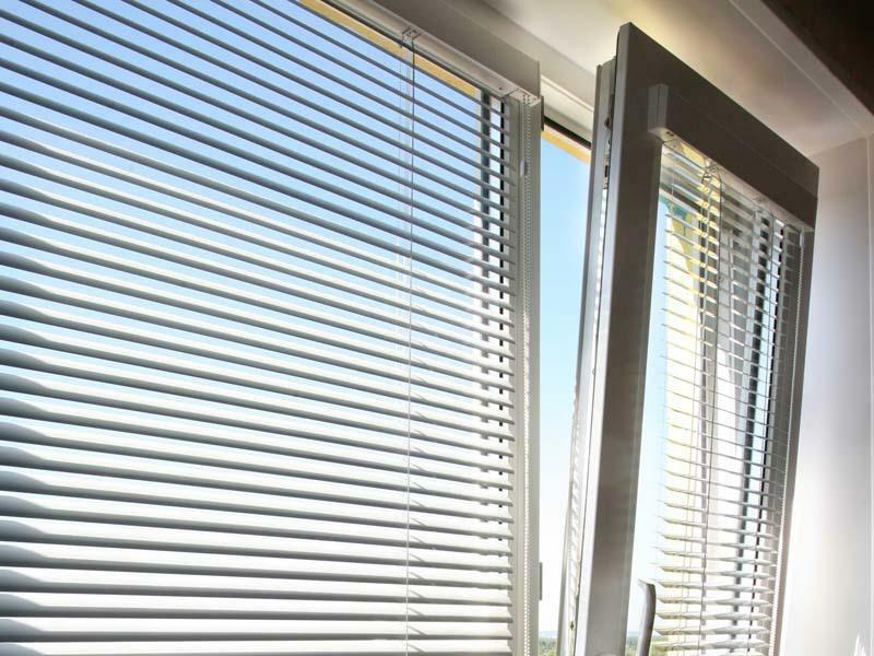 Blinds on the plastic windows of the photo: horizontal photo shutters, window views on double-glazed windows, which are colored