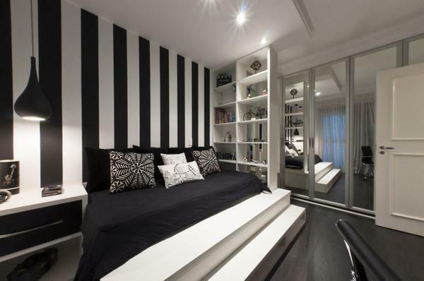 A marvelous combination of elegant black and refined white in the design of the bedroom is universal and can be used as a component of the interior in any style