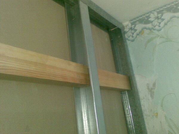In the photo we see the mortgage pre-pasted board for mounting shelves to wall.