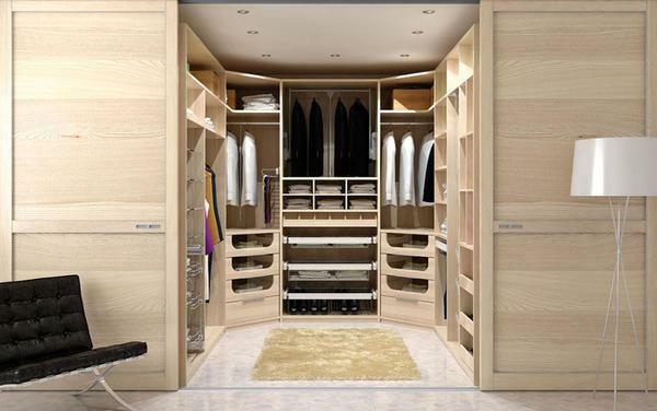Even a small dressing room in the bedroom not only hides clothes and other things, but also significantly saves space in the room
