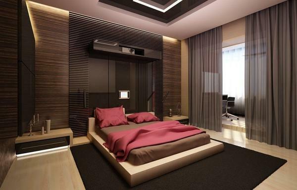 Attributes of the modern bedroom are neon lights near the bedside tables and built-in electronic gadgets