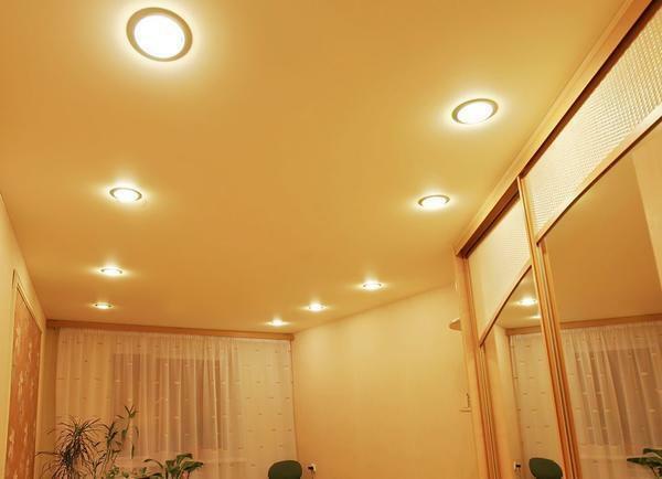 Stretch PVC ceilings have a fairly wide temperature range of use, however, installing the built-in lamps, one must take into account that they can also heat the cloth