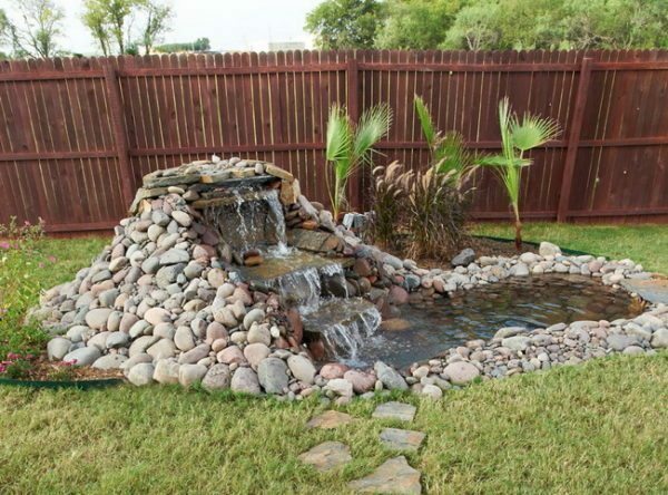 Decorative fountain will allow your site to stand out favorably against the background of the neighborhood