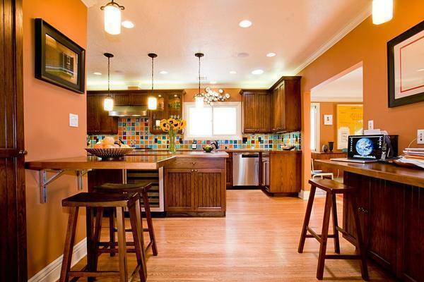Den orange färgen är bäst lämpad för köket: det stimulerar aptiten och anpassar sig till positiva känslor
