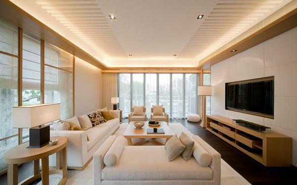 In a rectangular hall made in the style of minimalism, it is better to look at spotlights than a volumetric chandelier