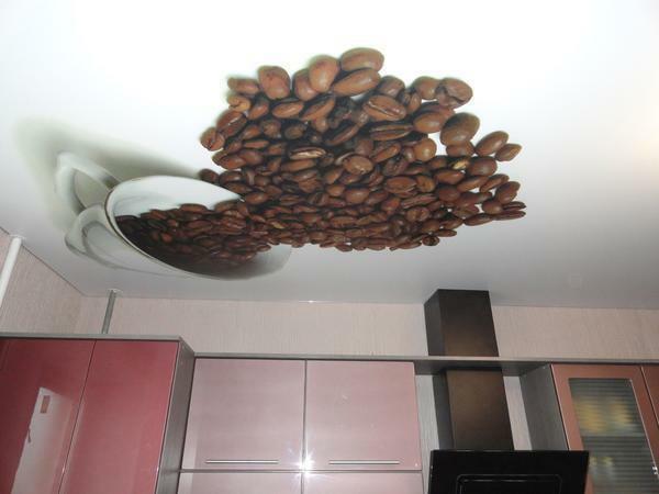 In the kitchen, it is recommended to apply thematic photo printing on the ceiling: a cup of coffee, fruit or vegetables