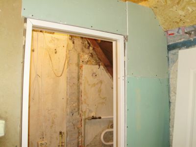 In this photo - door frame, installed in the doorway drywall partitions