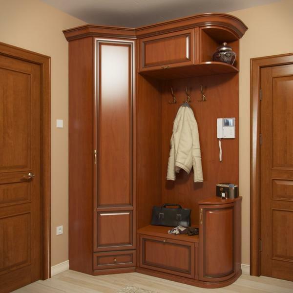 If you do not have a large enough hallway - a corner cabinet for storing shoes will come to the rescue