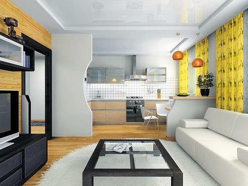 Het combineren van de keuken en de woonkamer wordt gedaan met behulp van architectonische elementen die de ruimte in functionele gebieden te verdelen