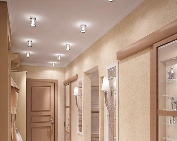 For long corridors, it is better to use light tones of the ceilings and lighting to do evenly over the entire area of ​​the ceiling
