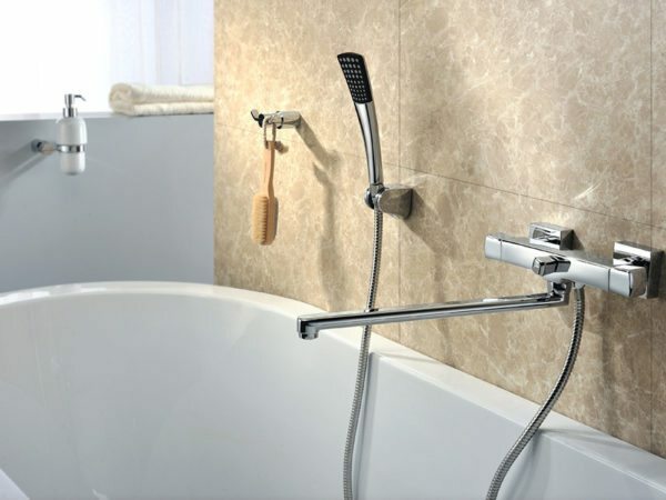 Bath and raised above the mixer with long spout allow you to do without a sink.