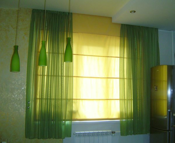 Blinds and curtains made of fabric exquisitely combined in the interior
