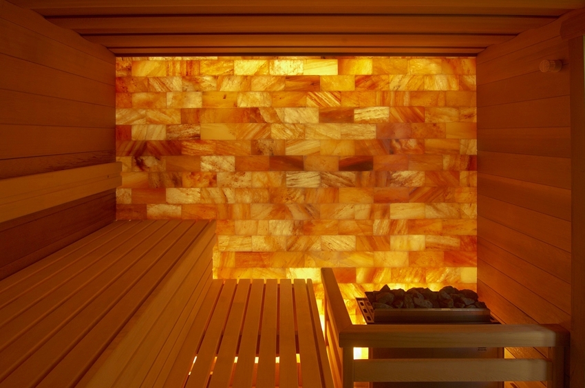 The wall of the steam room is made of Himalayan salt with lighting