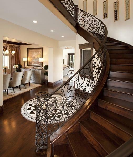 Forged railing will decorate the wooden staircase in the classical style