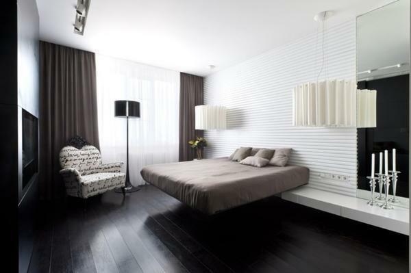 A bedroom in high-tech style is a spacious room with a lot of modern technology