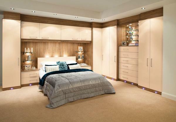 Beige wardrobe with spotlights in the bedroom will perfectly fit into any interior