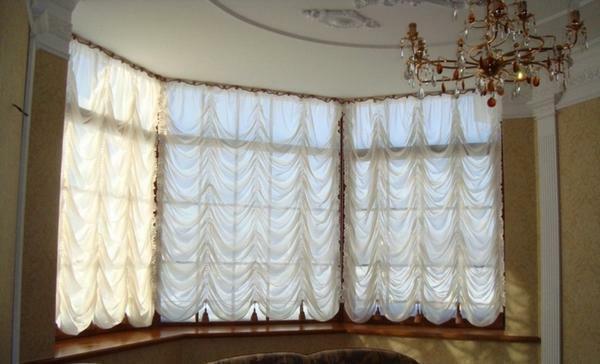 Curtains of French style are considered the most suitable option for a corner window