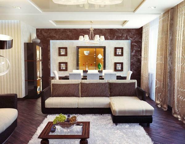 Living room in beige-brown colors: a photo of a light hall, an interior in black, furniture white, a combination of green