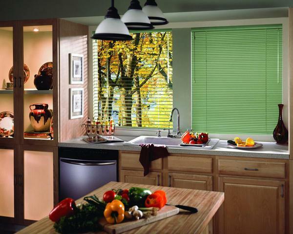 Quite convenient and practical are horizontal blinds in the kitchen