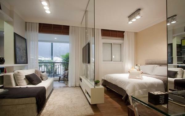Zoning the room can be done with a glass partition, which will look great in almost any interior