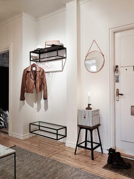 Compact mini-shelf in the corridor will help to hide excess objects in the room