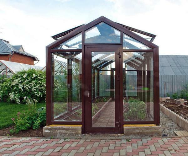 Beautiful, practical and safe is an elite greenhouse made of plastic windows