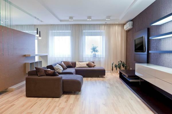 Arrangement of furniture in a rectangular living room must be done in such a way that it is not only along long walls, but also perpendicular to them