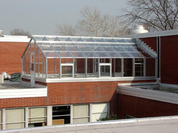 The greenhouse on the roof is an excellent option for those who do not have enough space on the plot to build