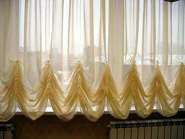 The living lush Austrian or French curtains will look great