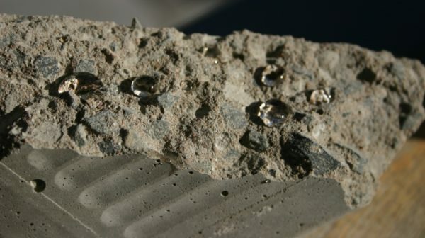 Concrete with high quality hydrophobic treatment is practically not wetted by water.