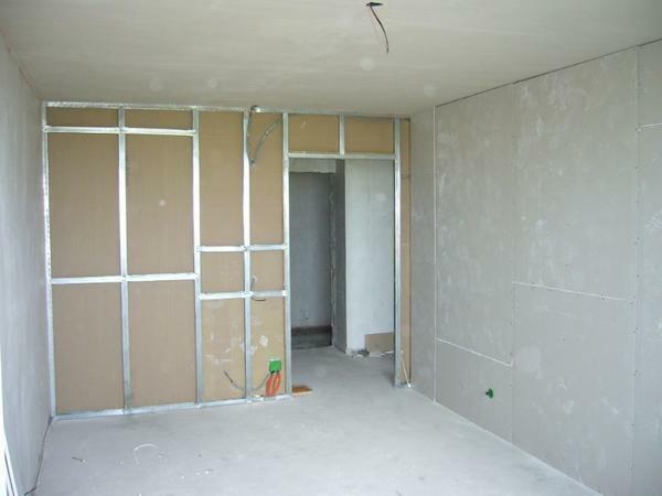 After the interior partitions have been installed, the process of puttying, grouting and grinding