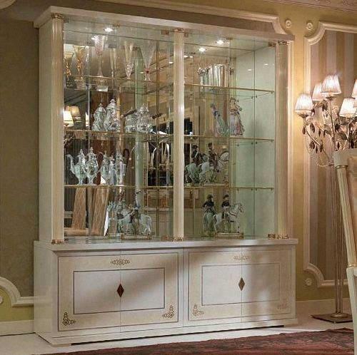 A beautiful wardrobe-cabinet is able to make the interior of the living room elegant and elegant