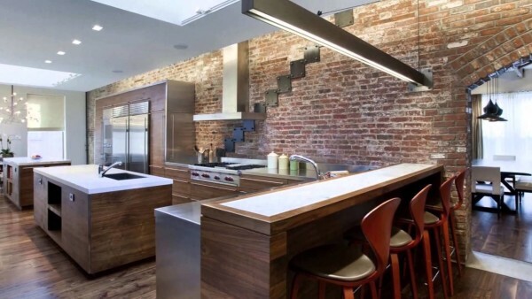 Open plan kitchen with dining area, decorated in the style of a loft