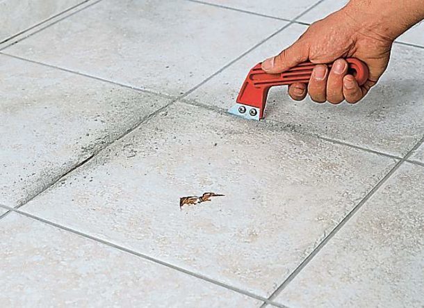 The removal of the old tile begins with the cleaning of the seams
